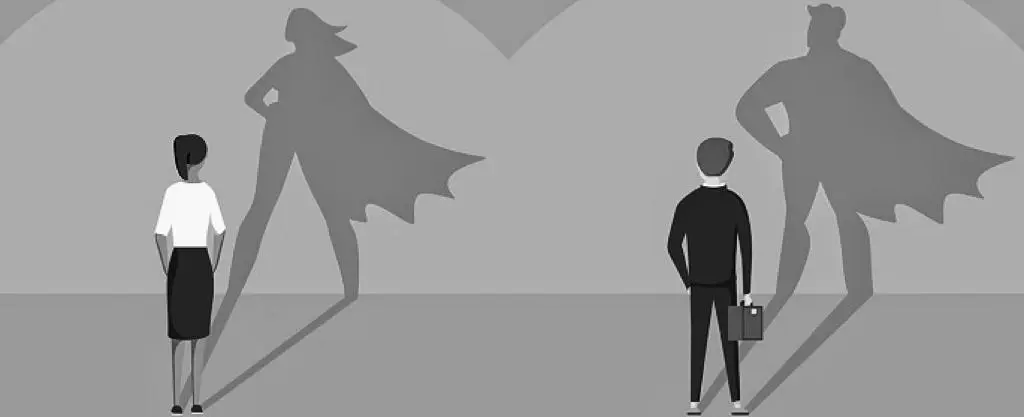 Two people in work attire stood in front of a wall with their shadows taking the shape of superheros